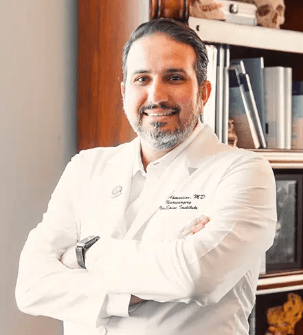 Dr. Amir A. Ahmadian, board-certified neurosurgeon, in his office
